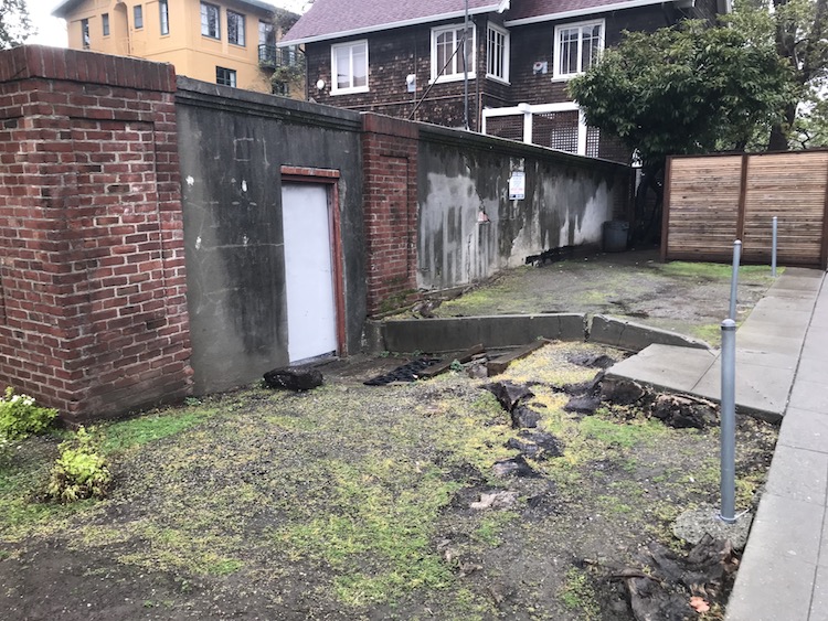 Wall and gate are crumbling.